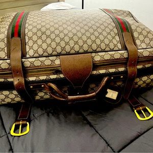 Gucci supreme leather luggage